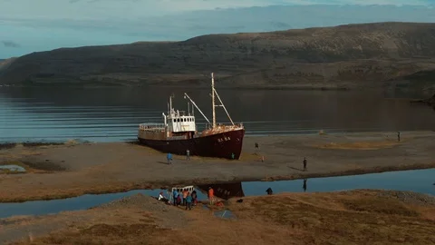 Aerial fly through view of a ship wreck on a fiord in West Iceland Stock Footage 119207186
