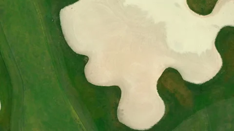 Aerial fly top view of golf field. bird view over Golf course in tropical Stock Footage 168485906