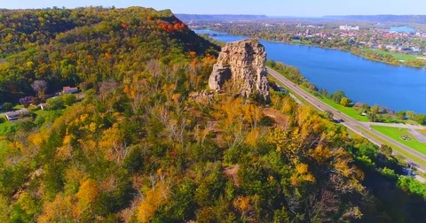 Aerial flyby of Sugarloaf Rock by Lake Winona, Minnesota Stock Footage