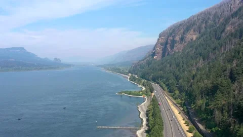 Aerial flying above Interstate 84 freeway and Columbia River Gorge in Oregon. Stock Footage 167618699