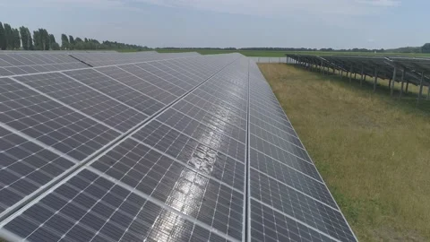 Aerial. Flying above solar panel generating plant. Stock Footage 136450157