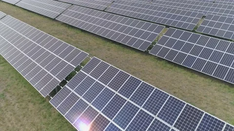 Aerial. Flying above solar panel generating plant. Stock Footage 136450302