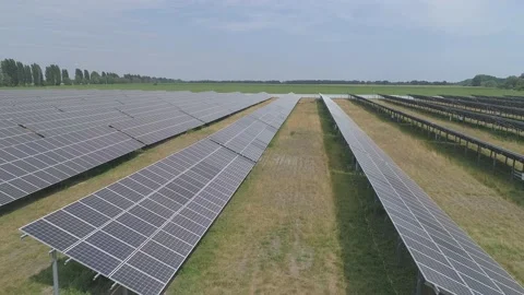 Aerial. Flying above solar panel generating plant. Stock Footage 136452622