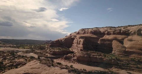 Aerial flying up and over dramatic sandstone formations and canyons Stock Footage 117865100