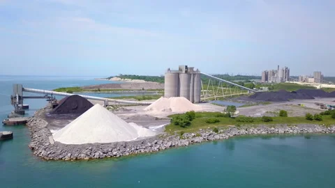 Aerial flying around a large aggregate quarry on a sunny day. Stock Footage 135485699