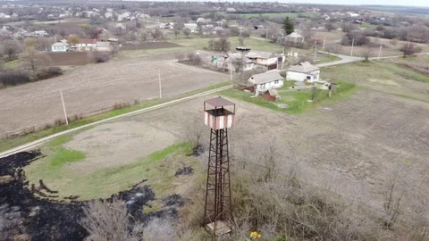 AERIAL. Flying around the observation tower overlooking the village. Vídeos de archivo 127320342