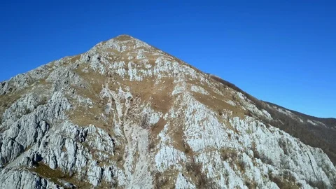 Aerial: Flying arround highest hill in Karst region of Slovenia called Nanos. Stock Footage 110739126