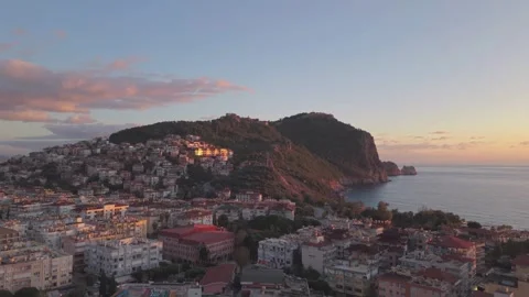 Aerial flying backward with slight side tilt over Alanya city, Turkey Stock Footage 327459641