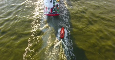 AERIAL: flying from behind the cargo ship navigate a pilot - 24 Vídeo Stock 80219697