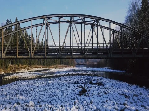 AERIAL | Flying below the old bridge Stock Footage 83305302