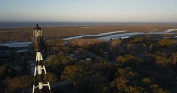 Aerial - Flying close to lighthouse on sunset Stock Footage 85645801