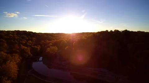 Aerial flying drone shot of dropping into the trees in a forest Stock Footage 68560616