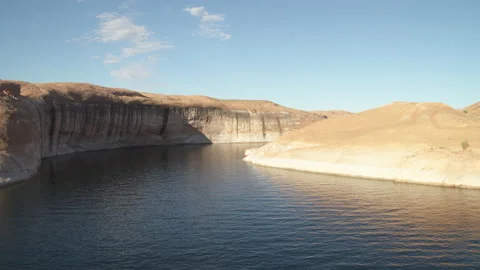 Aerial flying forward between red sandstone canyon walls above Lake Powell Stock Footage 233854512