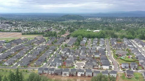 Aerial flying forward panning down towards houses in a new subdivision. Stock-Footage 155371518