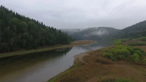 Aerial flying forward shot of mountain river flowing between the mountains Stock Footage 75477171