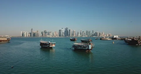 Aerial flying forward view of Doha boat harbour, corniche and West Bay, Qatar Stock Footage