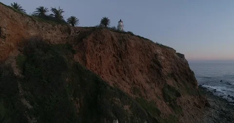 Aerial Flying up to Lighthouse by Ocean on a Cliff at Twilight in Palos Verdes C Stock Footage 89036629