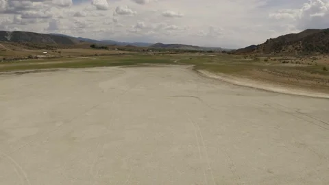 Aerial-Flying low over empty reservoir-Drained by extended drought Stock Footage 157704151
