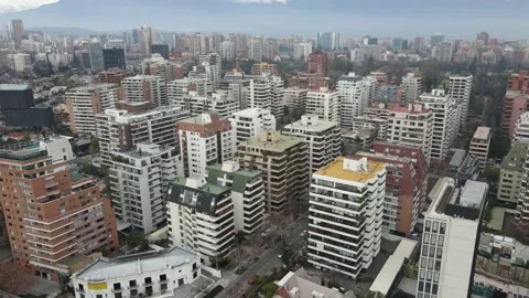Aerial flying over concrete jungle of apartment buildings in Santiago, Chil Stock Footage