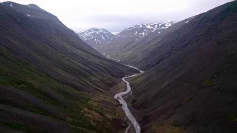 Aerial flying over dramatic Iceland landscape in valley with mountains. Video stock 166559528
