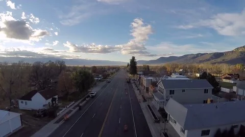 Aerial-Flying over empty small town main street pumpkins decorate post office Stock Footage 69097429