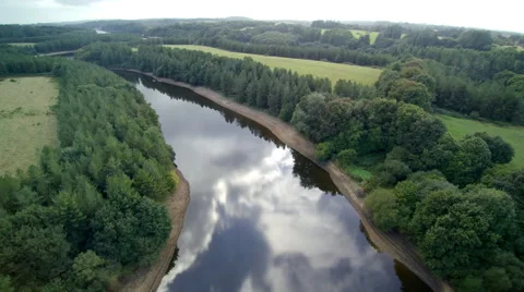 Aerial. Flying over a large river with windings in countryside.  4K. Stock Footage 68522573