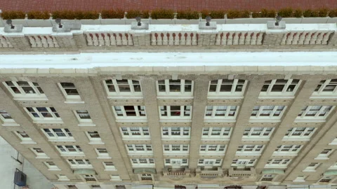 Aerial flying over old brick skyscraper - apartment / office / hotel Stock Footage 152049156
