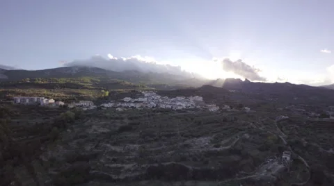 Aerial flying over olive trees towards Benimantell at sunset - Spain Stock Footage 59911147