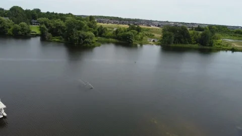Aerial Flying over a quiet river 4K pan at 100 feet Stock Footage 202904853