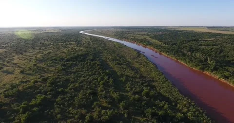Aerial - Flying Over a Red River in Texas Stock Footage 159453553