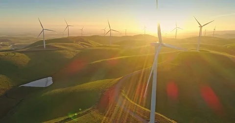Aerial Flying over Renewable Energy wind farm Wind Turbines Stock Footage 74071704