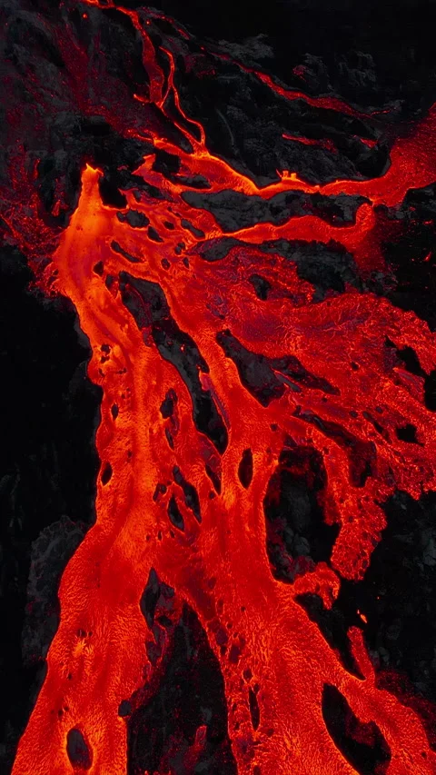 Aerial flying over rivers of red lava Iceland vertical Stock Footage 280210213