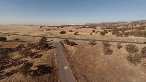 Aerial. Flying over the road through the field   Stock Footage 50992929