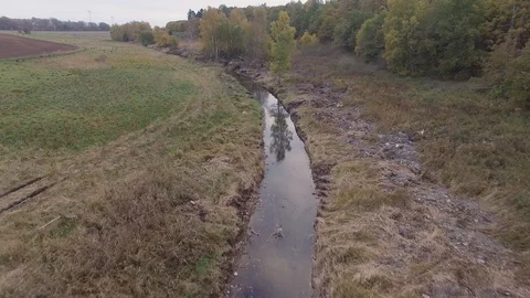 Aerial - flying over a small stream Stock Footage 97605756