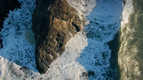Aerial Flying Over Waves Crashing On Rocks Coastline & Ocean Surf In California Stock Footage