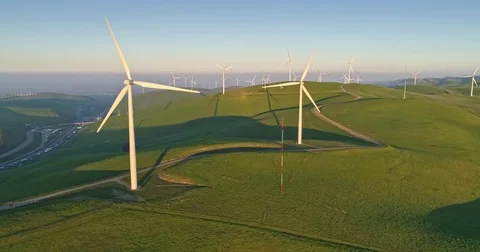 Aerial flying renewable energy wind farm Stock Footage