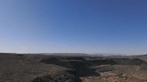 Aerial-Flying rim of basalt cliffs-Virgin River below Stock Footage 302323452