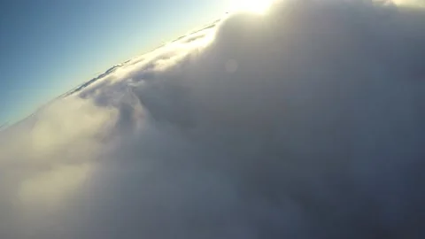 Aerial flying into sunset clouds  chasing plane Vídeo Stock 237883281