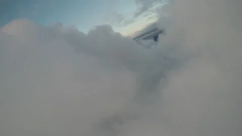 AERIAL FLYING THROUGH CLOUD OVER TOWN AFTER SUNSET Stock Footage 237884000