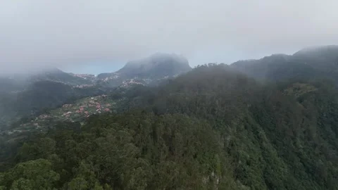 Aerial flying through the clouds in madeira Stock Footage 243310276