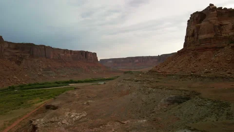 Aerial - Flying through a desert river canyon Stock Footage 143664552