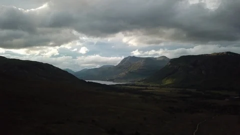 Aerial Flying Through Dramatic Scottish Landscape At Sunset Vídeo Stock 125177714