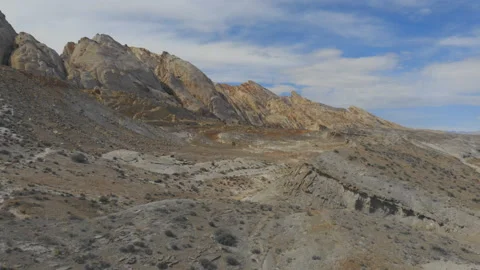 Aerial-Flying toward the eastern edge of a desert anticline geological formation Video stock 157120551
