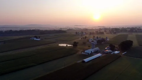 AERIAL flying toward Lancaster County, Pennsylvania farms in beautiful Stock Footage