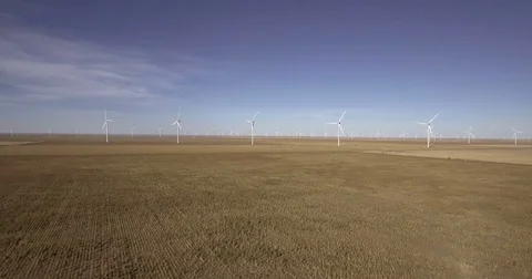 Aerial Flying toward Massive Wind Turbine Farm Stock Footage 75979106