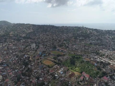 Aerial flying towards Freetown's National Stadium Stock Footage