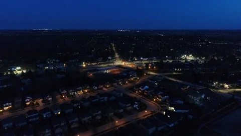 Aerial Flying Towards Intersection At Night Over House Rooftops Night Lights 스톡 동영상 121204929