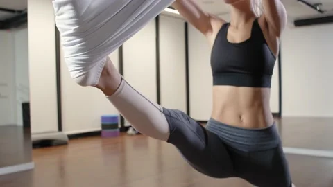Aerial flying yoga exercises practice in white hammock in fitness club. Footage Stock Footage 189009904