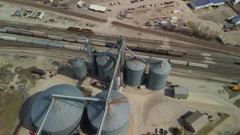 Aerial Flyover Above Grain Silos And Freight Trains In Illinois Stock Footage 342155168