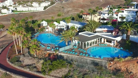 Aerial flyover above Morro Jable - Coast of Fuerteventura Canary Islands 動画素材 335509286